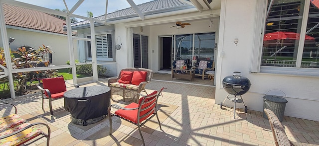 view of patio with a lanai and ceiling fan