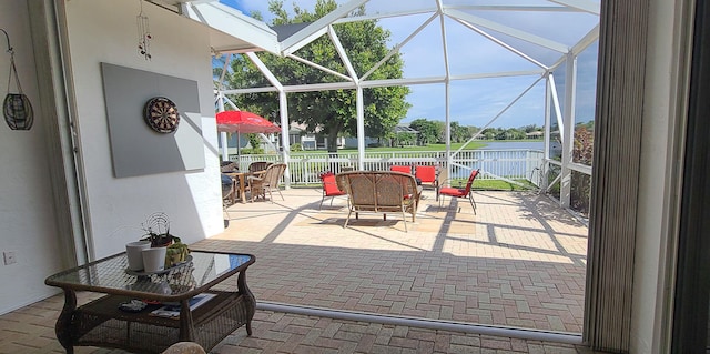 view of patio with glass enclosure