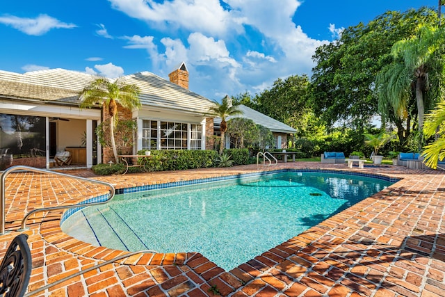 view of swimming pool with a patio area