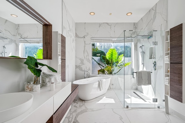 1026 Seasage Dr, Delray Beach, FL 33483 - bathroom featuring marble tiled flooring, a marble finish shower, a freestanding tub, and recessed lighting