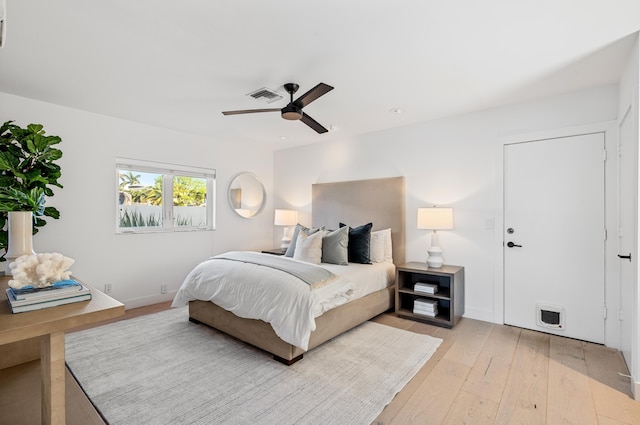 bedroom with ceiling fan and light wood-type flooring