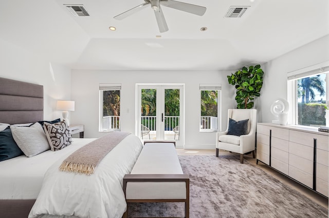 bedroom with access to exterior, multiple windows, french doors, and ceiling fan