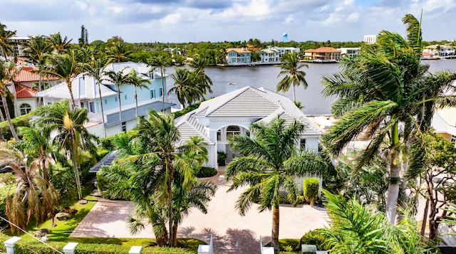 birds eye view of property with a water view