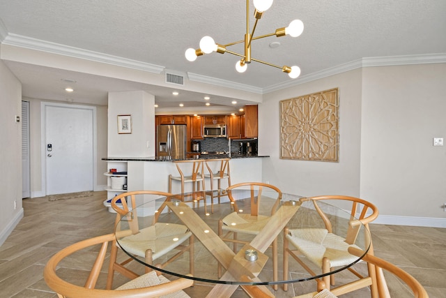 dining room featuring light wood-type flooring, crown molding, an inviting chandelier, and a textured ceiling