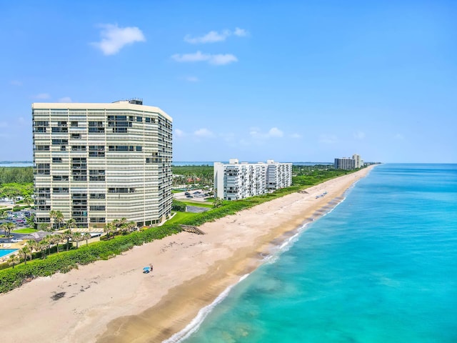 drone / aerial view featuring a view of the beach and a water view