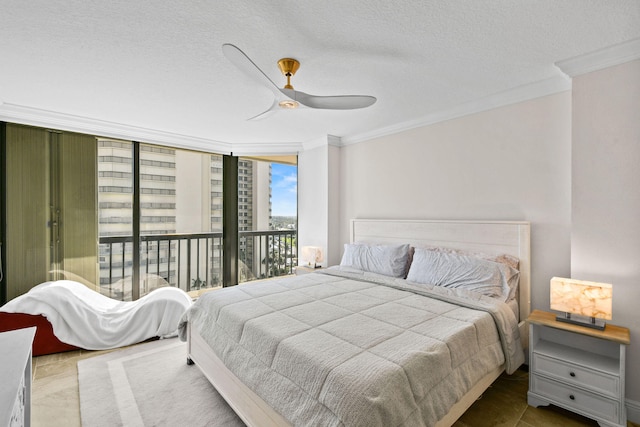 bedroom featuring ceiling fan, a textured ceiling, crown molding, and access to exterior