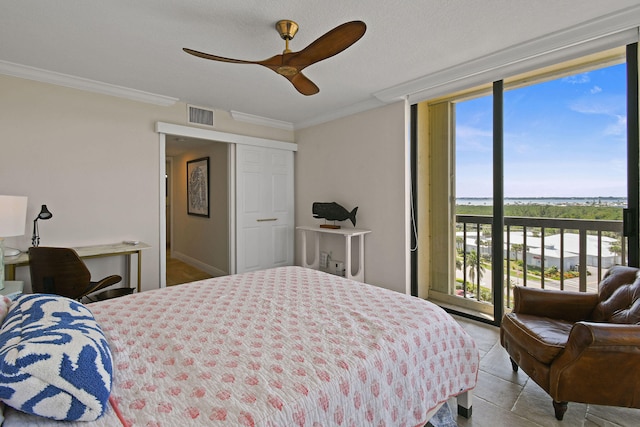 bedroom with ceiling fan, access to outside, ornamental molding, and multiple windows