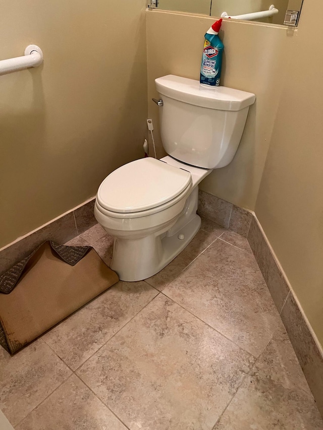 bathroom featuring toilet and tile patterned floors