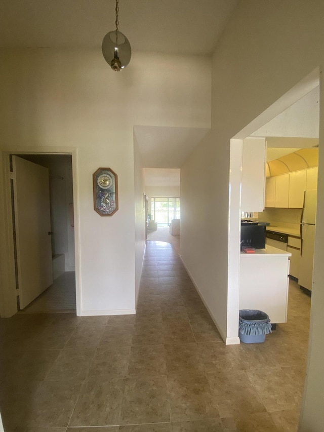 7926 Willow Spring Dr Unit 1325, Lake Worth, FL 33467 - hallway with a towering ceiling and baseboards