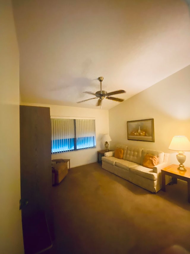 carpeted living room with ceiling fan and lofted ceiling