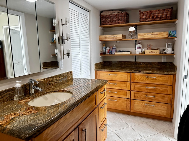 bathroom with tile patterned flooring and vanity