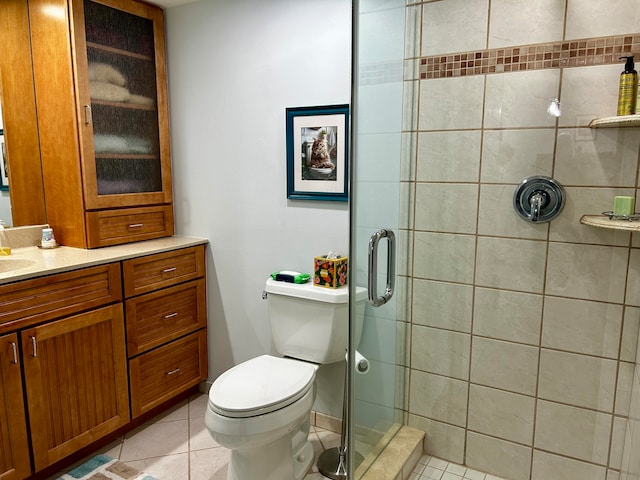 bathroom with tile patterned flooring, walk in shower, vanity, and toilet