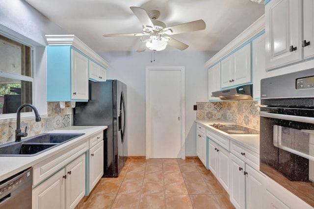 kitchen with black appliances, backsplash, white cabinets, and sink