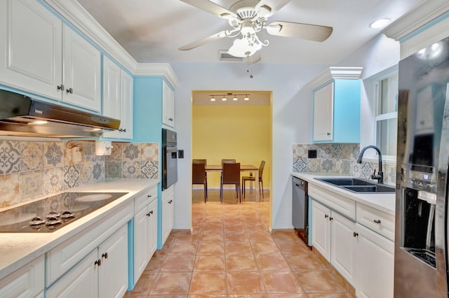 kitchen with decorative backsplash, sink, white cabinets, and black appliances