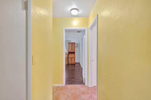 hallway featuring light tile patterned floors