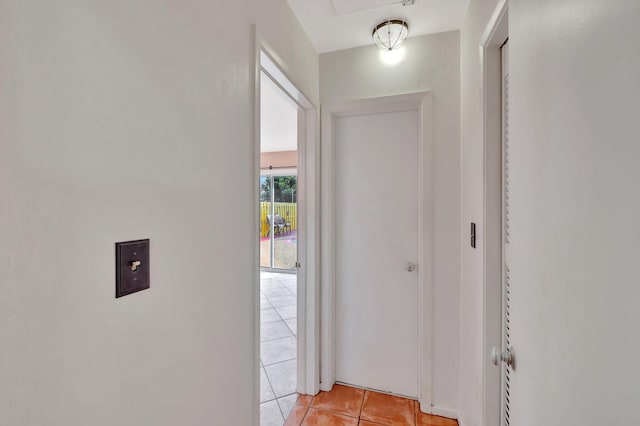 hallway featuring light tile patterned floors