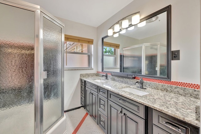 bathroom featuring tile patterned floors, vanity, and walk in shower