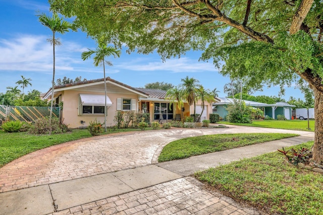 ranch-style home with a front yard