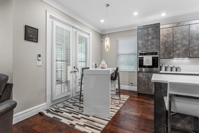 dining space with baseboards, a textured wall, dark wood-type flooring, and crown molding