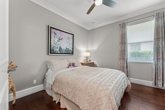 bedroom featuring ornamental molding, a ceiling fan, baseboards, and wood finished floors