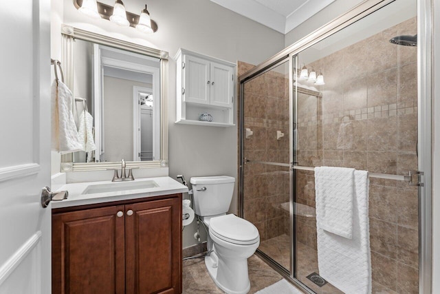 full bath with a shower stall, toilet, and vanity