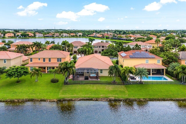 drone / aerial view featuring a water view and a residential view