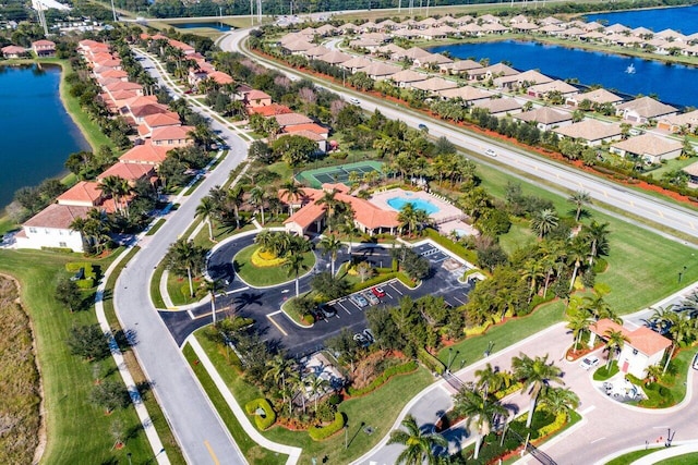 bird's eye view featuring a water view and a residential view