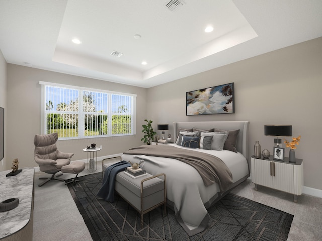 carpeted bedroom featuring a tray ceiling