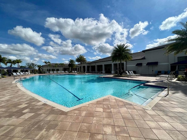 view of pool featuring a patio