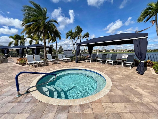 view of swimming pool with a patio and a gazebo