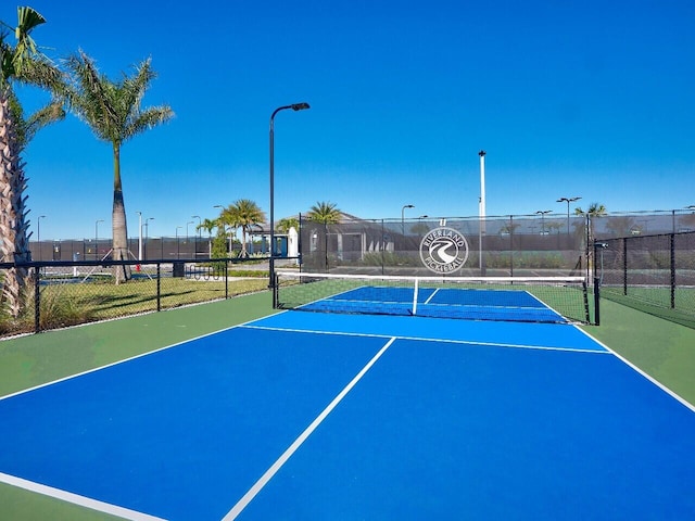 view of sport court with basketball hoop