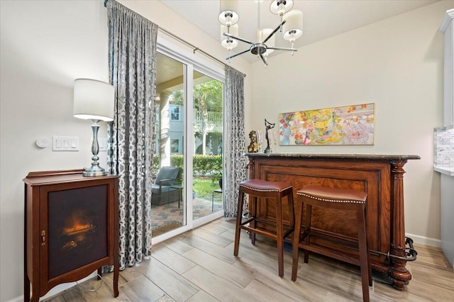 interior space featuring a chandelier and light wood-type flooring