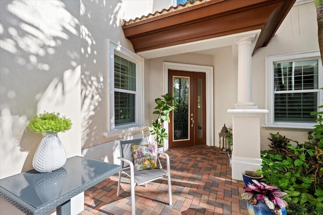 property entrance with a patio area