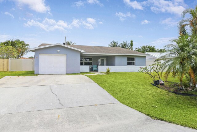 doorway to property featuring a yard and a garage