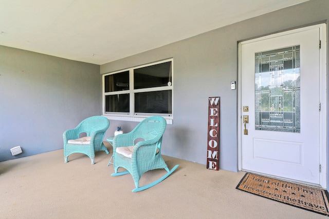 view of exterior entry featuring a porch