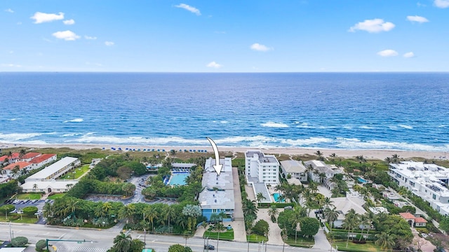 drone / aerial view featuring a water view and a beach view