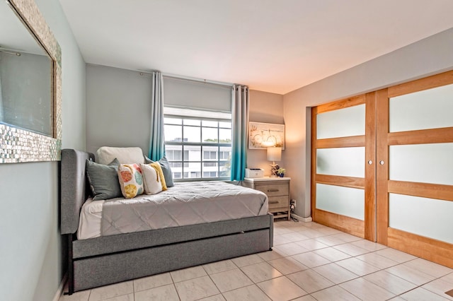 tiled bedroom featuring french doors