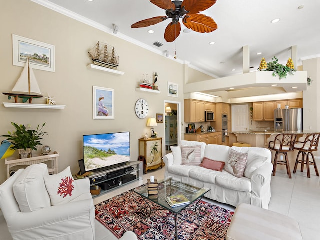 living room with ornamental molding, ceiling fan, and light tile patterned floors