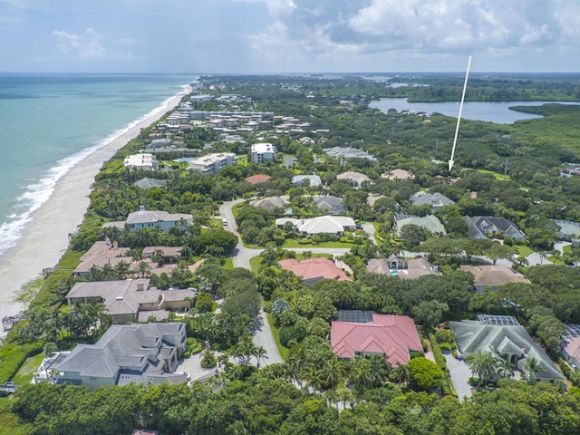 aerial view with a water view and a view of the beach