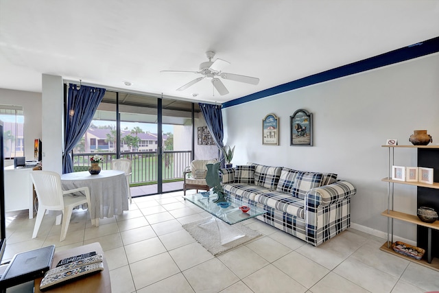 living room featuring ceiling fan and light tile patterned floors