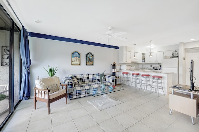 tiled living room featuring ceiling fan