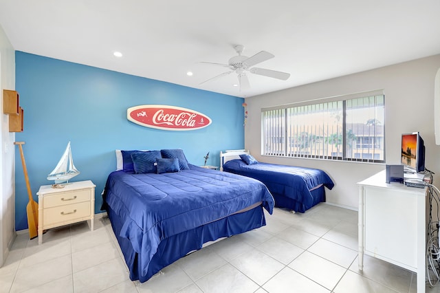 tiled bedroom featuring ceiling fan