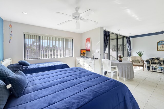 bedroom with ceiling fan and light tile patterned flooring