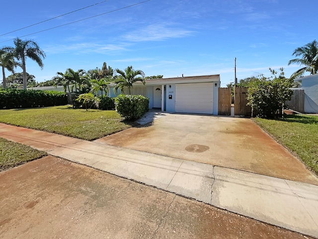 view of front facade featuring a front yard and a garage