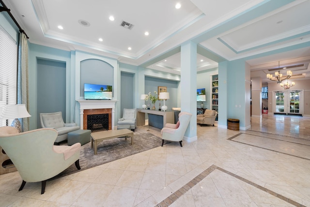 living room featuring a notable chandelier, crown molding, and a tray ceiling