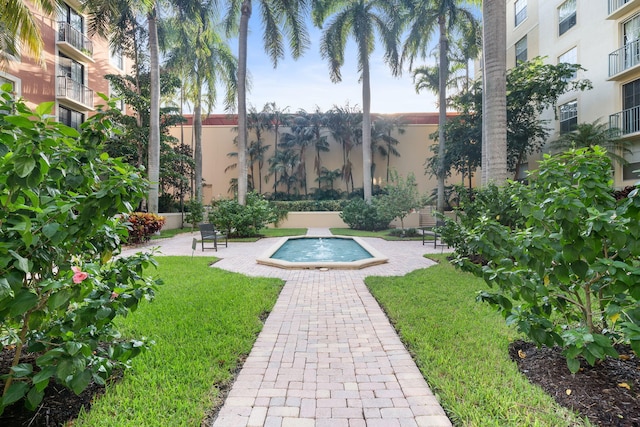 view of swimming pool featuring a lawn