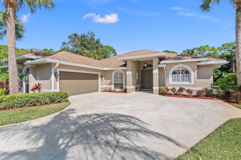 view of front of property with a garage