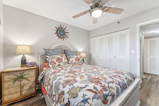 bedroom featuring dark hardwood / wood-style floors, a closet, and ceiling fan