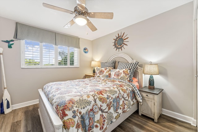 bedroom featuring dark wood-type flooring and ceiling fan