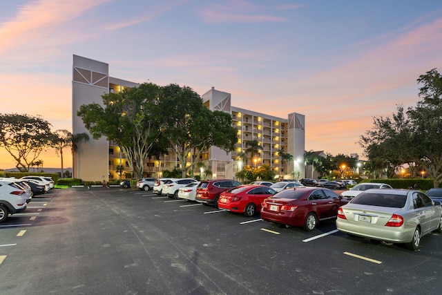 view of parking at dusk